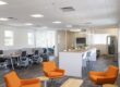 Open coworking area at Work Space on 5th in Delray Beach, featuring high-top tables and Focus Desks for members.